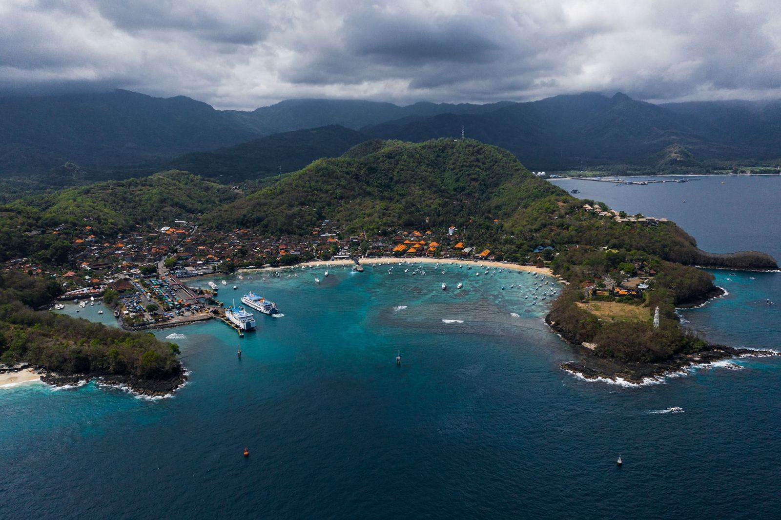 Aerial view of Padang Bai harbour with ferries at the pier